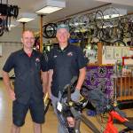 This July, Mike Wanner, owner of All Around Bikes, on right, plans to close his business while leaving operations to manager Jon Porlier, left, through then. For now the store inventory is 20 percent off. (Matthew Nash/Olympic Peninsula News Group)