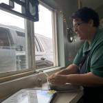 Christina Norman, co-owner of WeDo Fudge in Carlsborg, provides a fudge sample for a customer. She&rsquo;s also offering prayer now if people ask. (Matthew Nash/Olympic Peninsula News Group)
