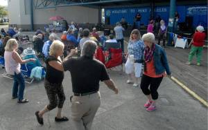 Audience members dance at a recent installment of the Concert on the Pier music series at Port Angeles City Pier. (Keith Thorpe/Peninsula Daily News)