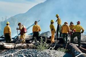 Brush fire, garage blaze keep Clallam firefighters busy