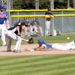 Dave Logan/for Peninsula Daily News Lefties baserunner Austyn Tengan slide safely into third base as the Bellingham Bells third baseman Ernie Yake waits for the ball to arrive