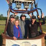Up to seven hot air balloons including Capt. Crystal Stout&rsquo;s balloon, pictured, could be flying over Sequim from Aug. 26-27, but organizers of the Olympic Peninsula Air Affaire need at least three or four passengers each day to make it viable. Here, Stout, at right, took up Dani Zanni of Montana and Debbie and Stan Gillian of Sequim on July 6. (Morning Star Balloon Co.)