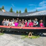Viola Penn Riebe, center, flanked by children, welcomed home with family and friends the Viola canoe during a ceremony at the Olympic Natural Resources Center in Forks. (Michael McNerney)