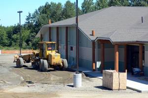 Work continues Tuesday on the Lower Elwha Klallam Tribe&rsquo;s new building, which will begin housing Klallam Counseling Services in August. (Jesse Major/Peninsula Daily News)