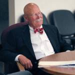 Former Clallam County Prosecuting Attorney David Bruneau sits outside the courtroom while waiting for his call to testify in a hearing for Tommy L. Ross Jr. on Tuesday. (Keith Thorpe/Peninsula Daily News)