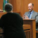 Former Port Angeles Police Chief Tom Riepe, right, answers questions from former county Prosecuting Attorney Deborah Kelly during testimony in a hearing for Tommy L. Ross Jr. on Tuesday in Clallam County Superior Court. (Keith Thorpe/Peninsula Daily News)