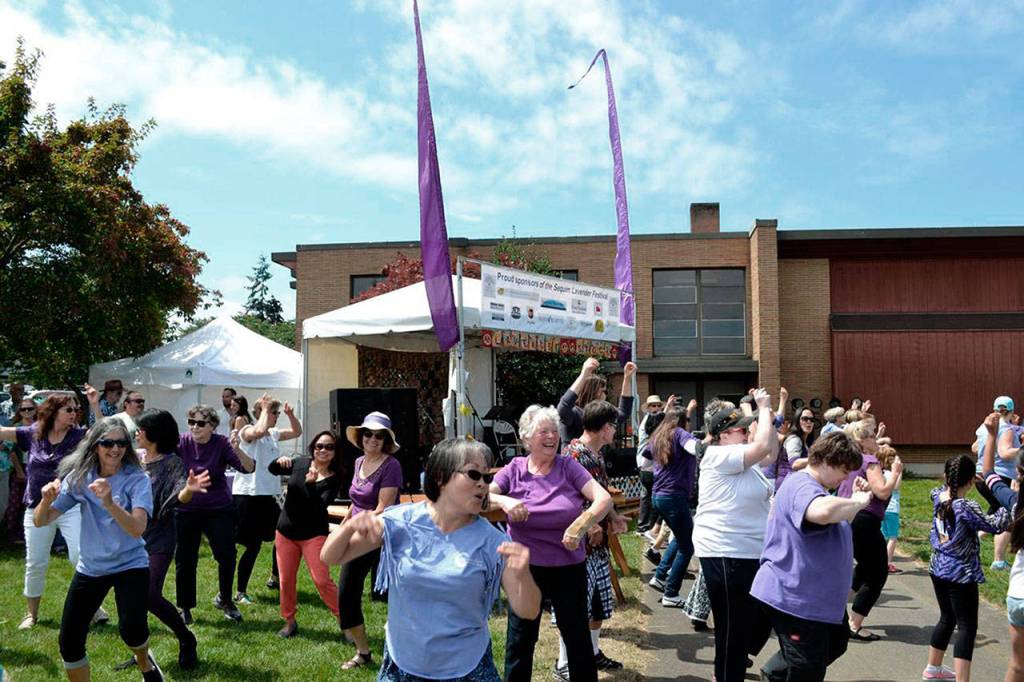 Dancers surprise visitors with a flash mob to Justin Timberlake&rsquo;s &ldquo;Can&rsquo;t stop the Feeling&rdquo; at last year&rsquo;s Sequim Lavender Festival street fair. The street fair runs Friday through Sunday this year on Fir Street between Sequim Avenue and Fifth Avenue. (Matthew Nash/Olympic Peninsula News Group)