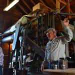 Bruce McCloskey, co-owner of B&B Family Farm, shows visitors last Sunday how they process lavender for various products. McCloskey and other lavender farmers are preparing for Sequim Lavender Weekend this weekend, which features more than a dozen farms. (Matthew Nash/Olympic Peninsula News Group)
