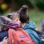 Laura Gray embraces family members Saturday before searching the Sol Duc River for her son, Jacob Gray, who has been missing since early April. (Jesse Major/Peninsula Daily News)