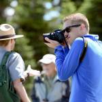 Mikah Meyer takes a picture during a short ranger-led hike at Hurricane Ridge on Wednesday. (Jesse Major/Peninsula Daily News)
