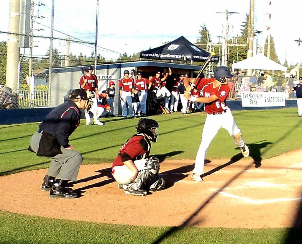 Pierre LaBossiere/Peninsula Daily News Wilder Senior&rsquo;s Bo Bradow prepares to swing at a pitch from Beyond Borders&rsquo; Ben Wong on Sunday evening. Beyond Borders won the game 8-3.