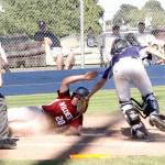 Dave Logan/for Peninsula Daily News Dave Logan/for Peninsula Daily News Reese Blatner of Wilder Senior slides successfully into home as Wilder Junior catcher Devin Batchelor tags him on Sunday afternoon. Wilder Senior won 13-2.