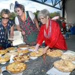 Apple pie contest volunteers, from left, Sally Fulton, Iantha Frazer and Edna Petersen sort through entries prior to judging during Independence Day festivities at Port Angeles City Pier. The contest was one of several events around Port Angeles on Tuesday, including a Fourth of July parade through the downtown area and fireworks over Port Angeles Harbor. (Keith Thorpe/Peninsula Daily News)