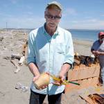 Volunteer Bob Frampton holds one of the larger mortars used in this year&rsquo;s Old School 4th of July fireworks show at Fort Worden. (Cydney McFarland/Peninsula Daily News)