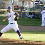 Dave Logan/for the Peninsula Daily News                                Nick Bonniksen of the Lefties pitches to the plate on the Fourth of July as his first baseman Michael Ciancio is ready in the background