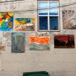 Paintings adorn the alley-side wall at the rear of Studio Bob in downtown Port Angeles. (Keith Thorpe/Peninsula Daily News)