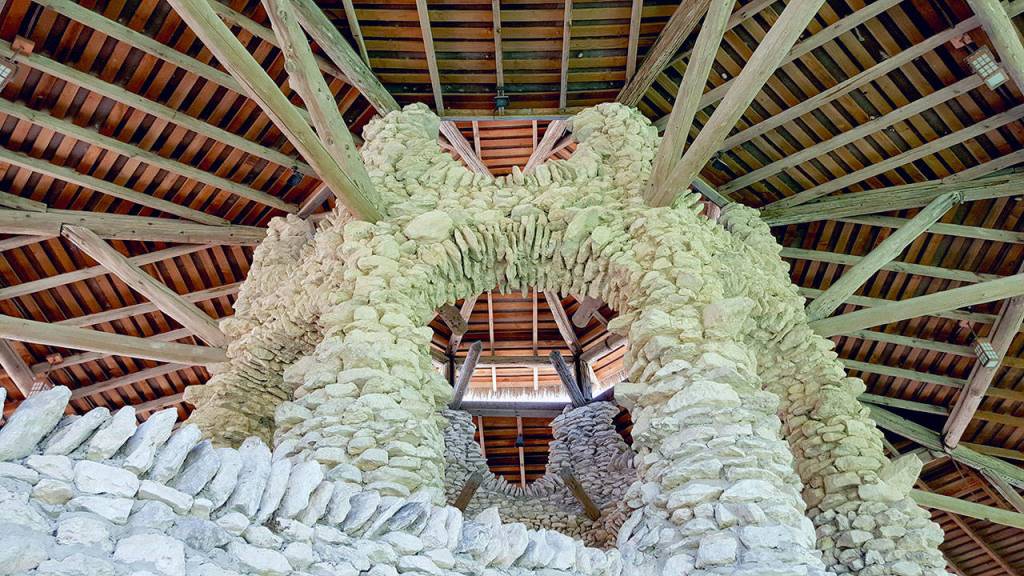 Admiring the stonework from the quarry in the grand gazebo and its beautiful roof lines. (Andrew May/for Peninsula Daily News)