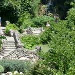 Looking up the stone pathway to the waterfalls cascading over the old quarry edge. (Andrew May/for Peninsula Daily News)
