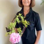 Janie Redifer shows an example of Ikebana, Japanese flower arranging.