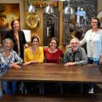 Jeri and Fran Sanford, fourth and fifth from left, recently listed their 20-year-old business, Over the Fence, for sale. They&rsquo;ve offered home furnishings from around the world for more than 20 years. Staff for the store include, from left, Katy Nichols, Bergen Carey, Emily Underwood, Jeri and Fran Sanford, and Joanie May. Not pictured are Iris Edey, Cathy Lopes and Chris Biedermanngarde. (Matthew Nash/Olympic Peninsula News Group)