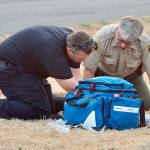A Clallam County sheriff&rsquo;s deputy and a paramedic attempt to resuscitate a dog which perished in a fire Wednesday evening in Port Angeles. (Jay Cline/Clallam Fire District No. 2)