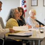 Port of Port Angeles executive director Karen Goschen talks with Clallam County PUD officials Aug. 1. Pictured from left are John Nutter, port director of finance and administration; Goschen; and Port Commissioners Colleen McAleer, Connie Beauvais and Steve Burke. (Michael Dashiell/Olympic Peninsula News Group)
