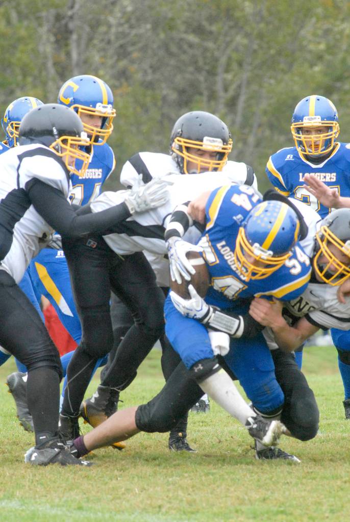 Crescent&rsquo;s Noah Leonard is taken down by a host of Clallam Bay Bruins during a game last season. Leonard led the team in tackles and running yards last season according to coach Brian Shimko.                                Keith Thorpe/Peninsula Daily News