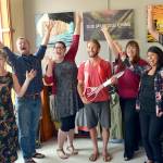Tyler Meeks, center, owner of the new Discovery Bay Outdoor Exchange, celebrates his opening day with a ribbon-cutting Friday with members of the Jefferson County Chamber of Commerce. (Cydney McFarland/Peninsula Daily News)