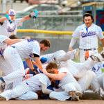 The Port Angeles Lefties celebrate an 11th-inning walkoff 17-16 win over the Victoria HarbourCats Sunday. The game took 5 hours to play and the two teams combined for 38 hits and 24 walks. (Jay Cline/for Peninsula Daily News)