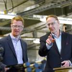 U.S. Rep. Derek Kilmer, D-Gig Harbor, left, talks with Composite Recycling Technology Center Chief Operating Officer Dave Walter during a tour of the facility Tuesday. (Jesse Major/Peninsula Daily News)
