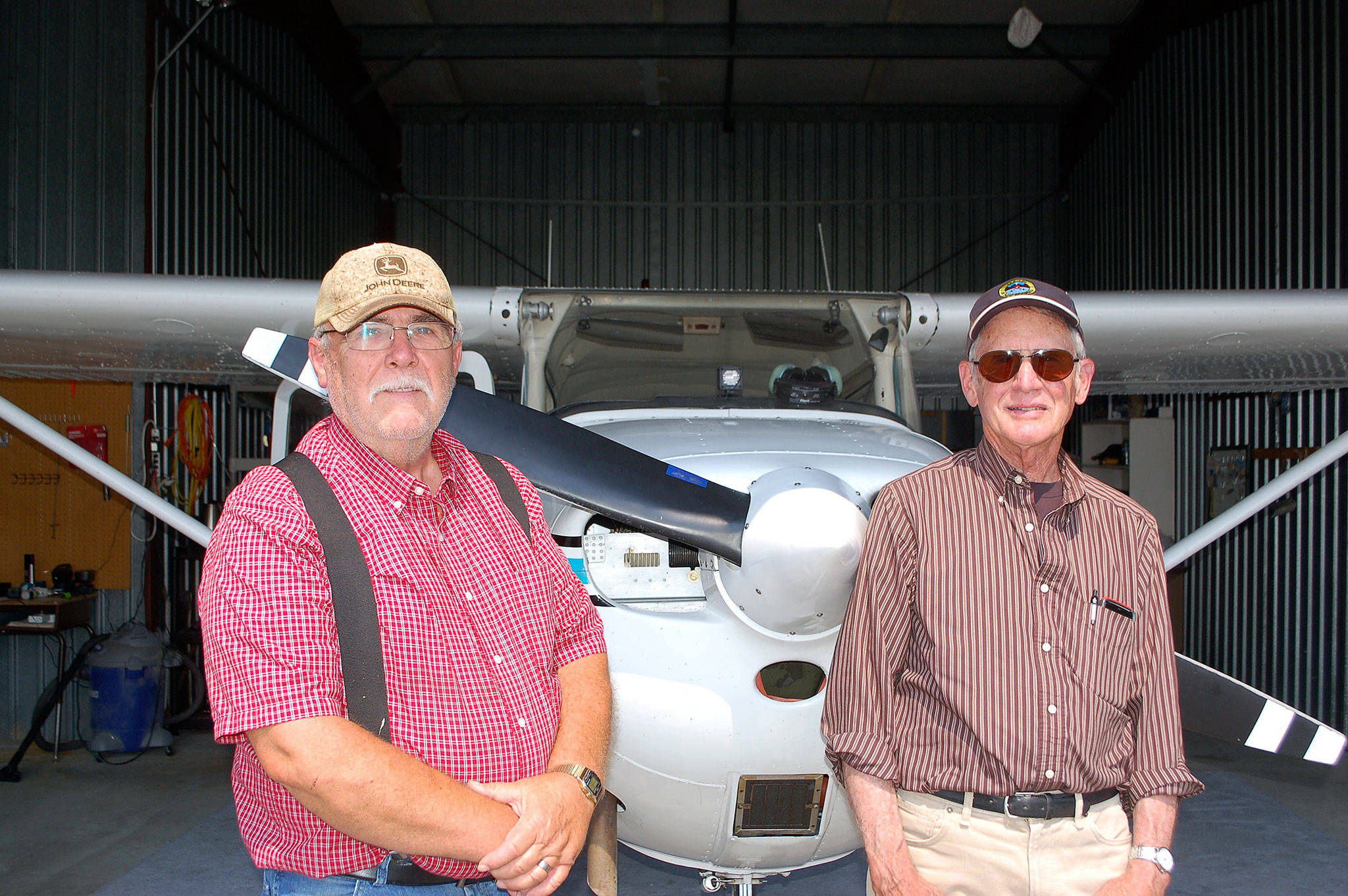 Erin Hawkins/Olympic Peninsula News Group                                Sequim residents and airplane owners Dan Ramberg, left, and John Meyers stand in Ramberg&rsquo;s airplane hangar at Sequim Valley Airport.