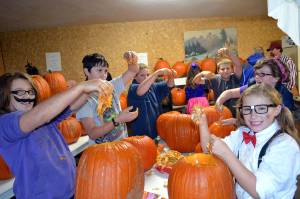 Children celebrate at the Pumpkin Party in the Sequim Prairie Grange&rsquo;s outdoor kitchen a few years ago. The event grew from an effort to start a Junior Grange in the area and has continued for 12 years each October. Sequim Gazette file photo by Matthew Nash