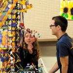 Ellie Hiigler and Justin Jackson with Port Angeles Junior ROTC look at a building block display created by 7-year-old Digeo Waterkotte of Port Angeles. This year, the Junior ROTC helped set up the Arts and Crafts barn. (Matthew Nash/Olympic Peninsula News Group)