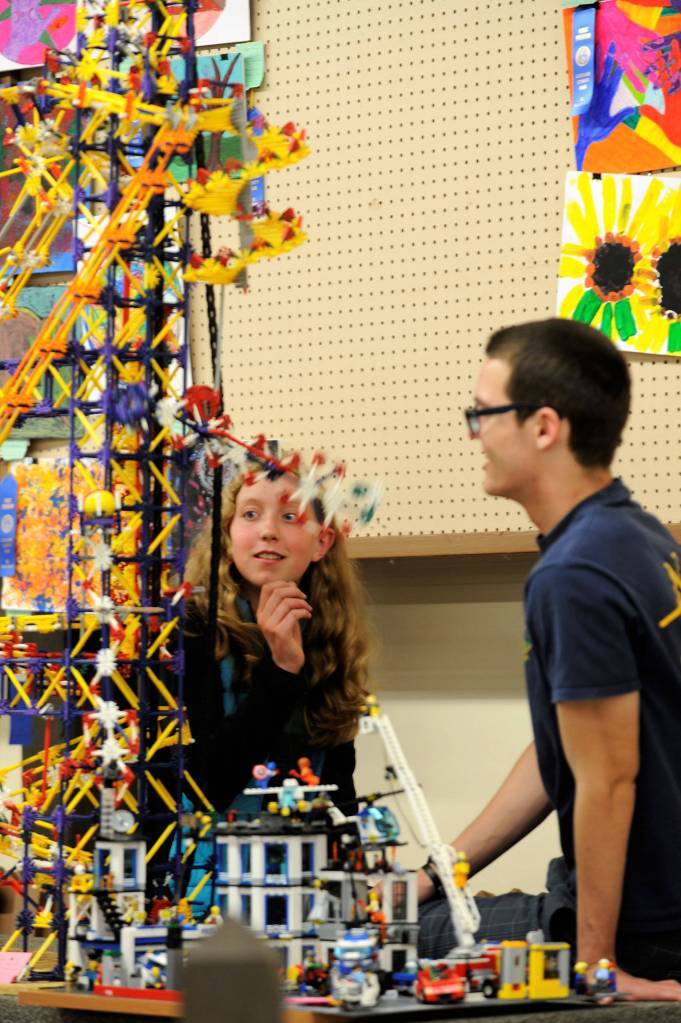 Ellie Hiigler and Justin Jackson with Port Angeles Junior ROTC look at a building block display created by 7-year-old Digeo Waterkotte of Port Angeles. This year, the Junior ROTC helped set up the Arts and Crafts barn. (Matthew Nash/Olympic Peninsula News Group)