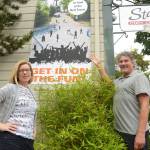 Polly Macomber, a Port Townsend-based graphic designer, and Mike Kenna, owner of Pintery Communications in uptown, are two of the people putting together this year&rsquo;s town portrait which will feature the historic bell tower in uptown Port Townsend. (Cydney McFarland/Peninsula Daily News)