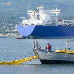 Crews unload an oil spill boom into Port Angeles Harbor during a training session Wednesday. (Jesse Major/Peninsula Daily News)