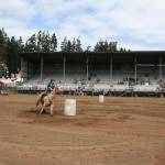 Emma Albright and Tinkerbell compete in barrel racing during the Clallam County Fair&rsquo;s 4-H games show. They finished with a fastest time of 16.357 seconds. (Karen Griffiths/for Peninsula Daily News)