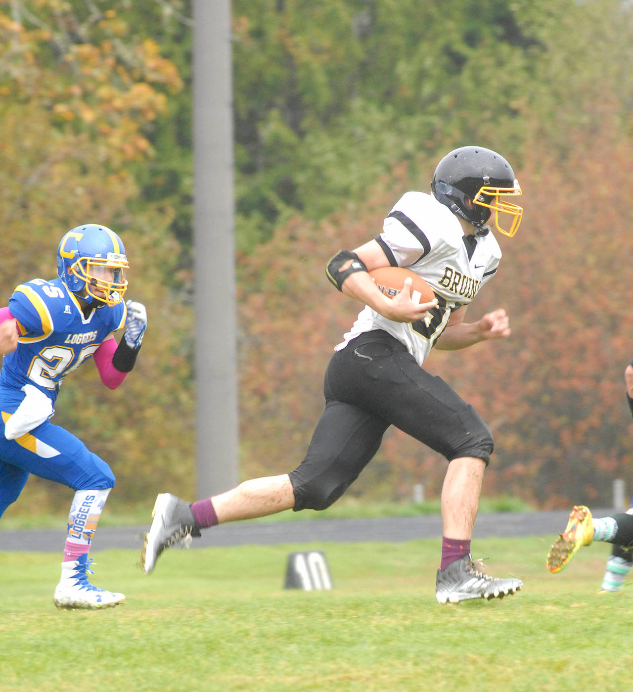 Clallam Bay&rsquo;s Ryan McCoy, right, runs with the ball during a game against Crescent in 2016. McCoy will play running back and middle linebacker for the Bruins this season.                                Keith Thorpe/Peninsula Daily News
