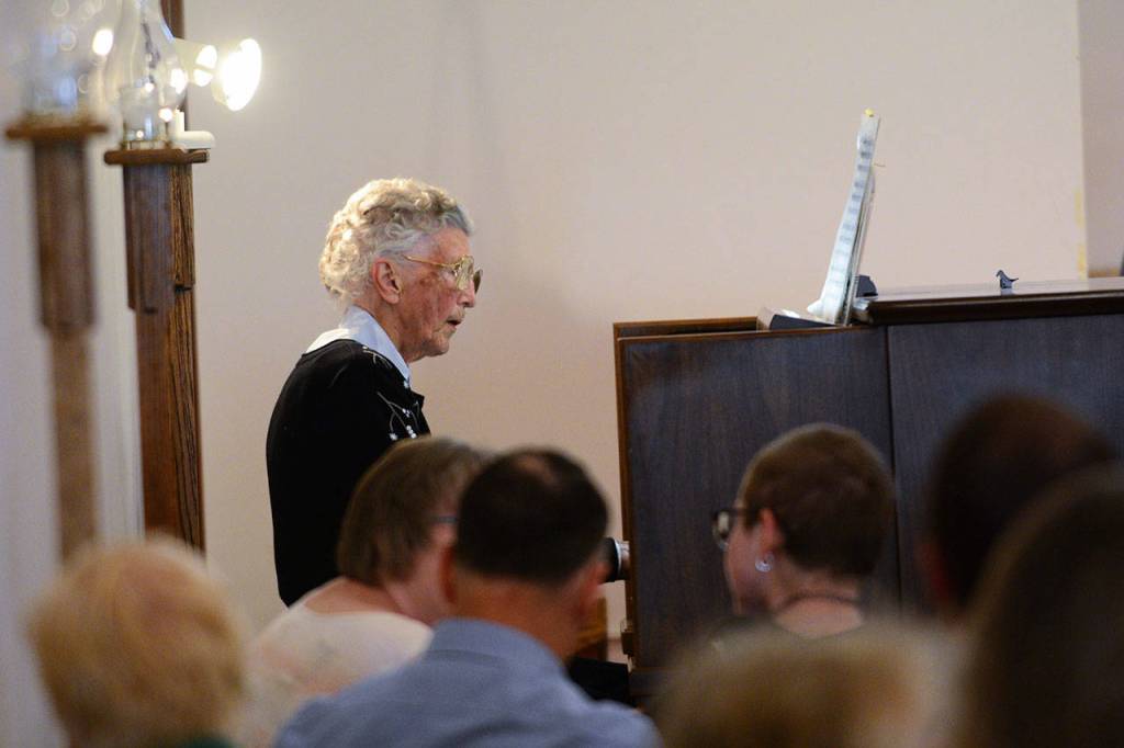 Anne Todnem of Port Angeles plays the organ at First United Methodist Church in Port Angeles as service begins Sunday, two days before her 100th birthday. (Jesse Major/Peninsula Daily News)