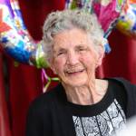 Anne Todnem smiles after singing with The Messengers during her 100th birthday party at First United Methodist Church in Port Angeles on Sunday. (Jesse Major/Peninsula Daily News)