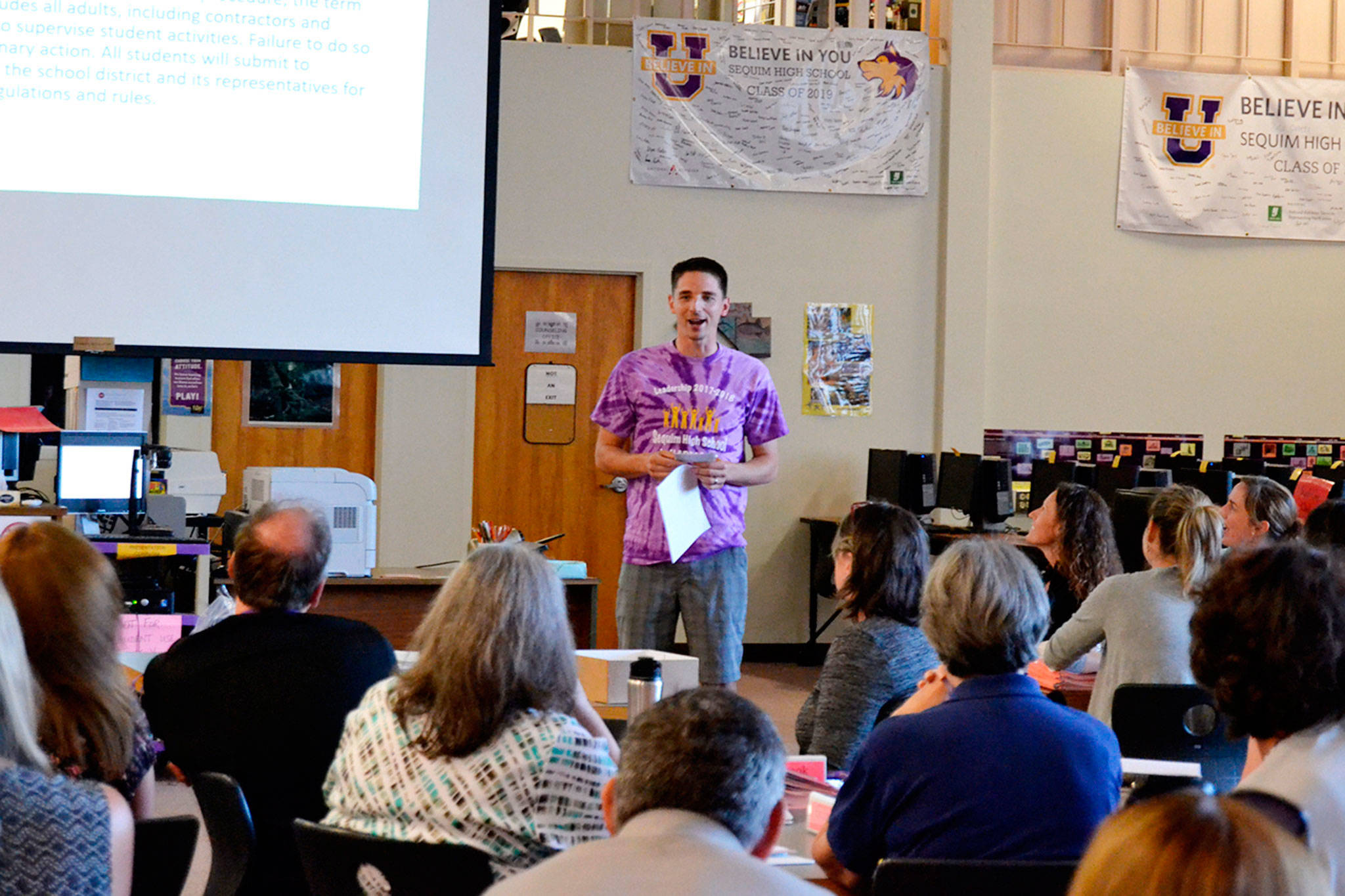 Teacher Sean O&rsquo;Mera answers co-workers&rsquo; questions about scheduling the bulletin this year at Sequim High School on Tuesday, a day before school started districtwide. (Matthew Nash/Olympic Peninsula News Group)