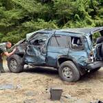 A Port Townsend woman was injured in a rollover wreck Thursday morning. Officials shut down traffic on Cape George Road in both directions while the scene was cleared. (Cydney McFarland/Peninsula Daily News)
