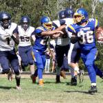 Crescent&rsquo;s Eric Emery runs the ball against Tacoma Baptist on Saturday in Joyce. (Dave Logan/for Peninsula Daily News)
