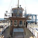 From the bow of the El Primero, a historic yacht currently in the Boat Haven boatyard in Port Townsend, the ship&rsquo;s dining room and captain&rsquo;s wheel house can be seen. (Cydney McFarland/Peninsula Daily News)