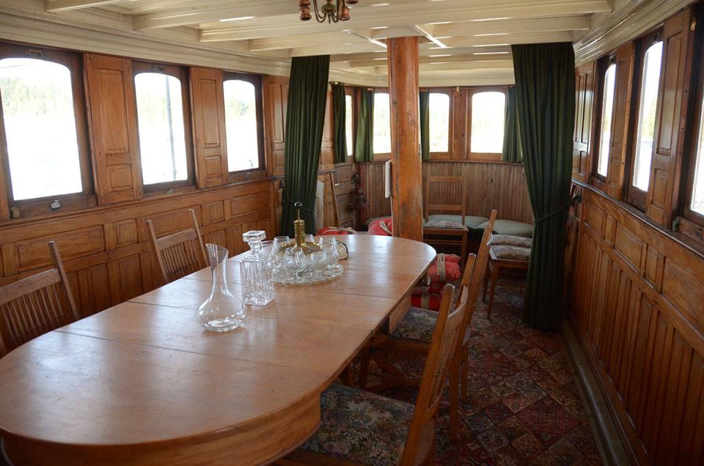 The dining room on the historic El Primero yacht has hosted presidents and famous faces such as Babe Ruth. (Cydney McFarland/Peninsula Daily News)