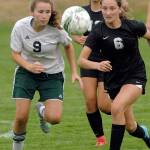 Port Angeles&rsquo; Delaney Wenzl, left, and Klahowya&rsquo;s Gabrielle Marcoux chase after the ball during first-half action on Tuesday at Port Angeles Civic Field. Following the play from behind is Klahowya&rsquo;s Rylee Radford. (Keith Thorpe/Peninsula Daily News)