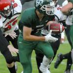 Port Angeles&rsquo; Garrett Edwards, center, carries the ball while avoiding the defense of Port Townsend&rsquo;s Jaden Steinfort, left, and Jacob Boucher, rear, during the first quarter on Friday at Port Angeles Civic Field.                                Keith Thorpe/Peninsula Daily News