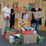 More than 1,000 new undergarments were packed and shipped Monday from Sequim&rsquo;s Dungeness Valley Lutheran Church to Texas as support for Hurricane Harvey victims. Volunteers Sue Brock, Kathy Lohrman and Andra Smith, from left, helped lead the effort with an &ldquo;Undie Sunday&rdquo; donation drive the day before at the church. (Matthew Nash/Olympic Peninsula News Group)