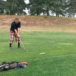 Port Townsend Golf Club General Manager and head pro Gabriel Tonan tees off in a one-hole playoff at the 14th Washington State Hickory Open last Saturday at the Home Course in Dupont. Tonan birdied the playoff hole to win the contest.