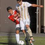 Peninsula&rsquo;s Manuel Galiano, front, fends off Everett&rsquo;s Juan Ortiz in first-half action on Wednesday in Port Angeles. Keith Thorpe/Peninsula Daily News